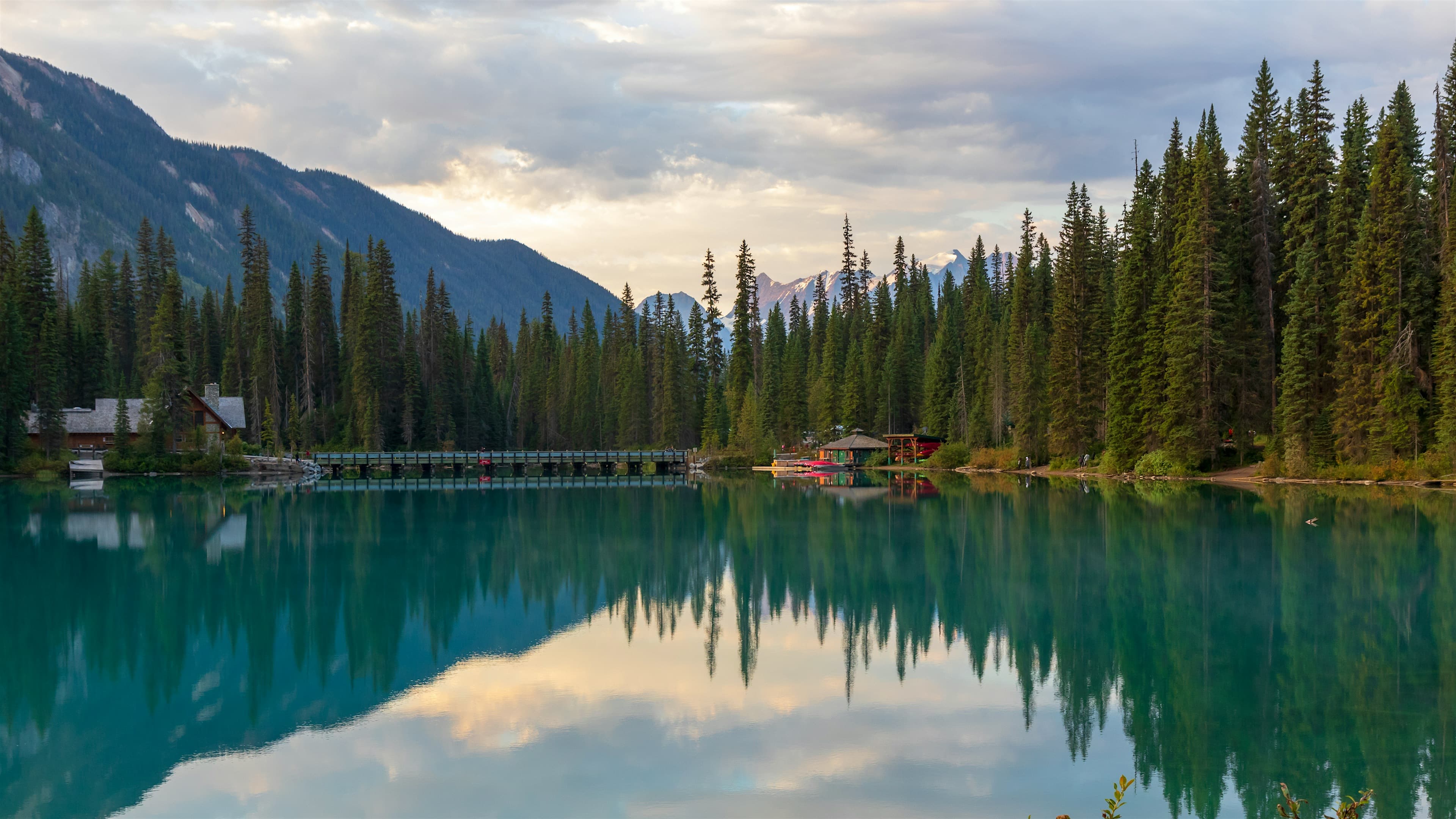 Serene mountain lake with forest reflections